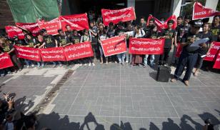Reporters hold banners as they attend a demonstration march for press freedom. Yangon, Myanmar. 7 January 2014. Editorial credit: Ye Aung Thu/AFP via Getty Images