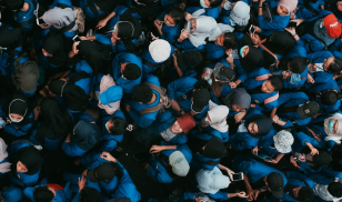 CHILDREN WITH PHONES IN A CROWD